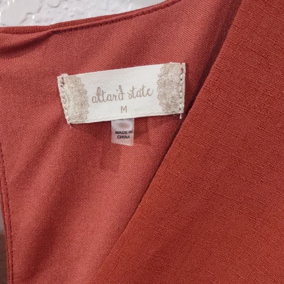 Altar'd State Rust Long Sleeve Peplum Jumpsuit. - Picture 6 of 17